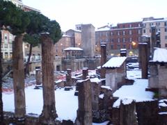 Snow on the temple of Largo Torre Argentina in Rome