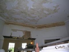 Hamilton Grange parlor ceiling with splotchy paint and browning woodwork