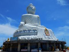 scenic Phuket beach with clear blue waters and lush greenery