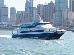 Xin Huisan ferry with CKS logo heading towards Cheung Chau in Victoria Harbor