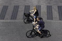 Cyclists crossing Norrbro Bridge in Stockholm