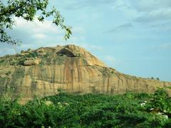 Panoramic view of Yanaimalai hill with rocky terrain and sparse vegetation