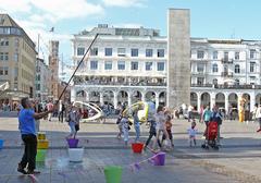 Hamburg Rathausplatz with historic buildings and people walking