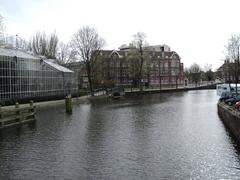 A scenic view of Amsterdam with canal houses and boats