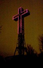 Mount Royal Cross illuminated in purple at night