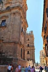 Málaga cityscape with historical buildings and lush greenery