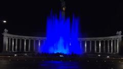 blue illuminated fountain at night