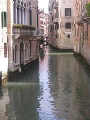 Scenic view of a canal in Dorsoduro, Venice with colorful buildings reflecting in the water