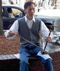 Erhu player performing at Harvard Square