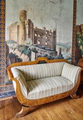 Sofa in front of historic wallpaper at Stapel Manor in Havixbeck, Germany