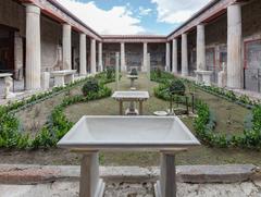 Ancient city of Pompeii with ruins and Mount Vesuvius in the background