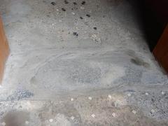 House of the Vettii bedroom in Pompeii with lava sill and beaten travertine floor