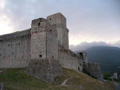 Panoramic view of Assisi featuring historic buildings and clear blue sky