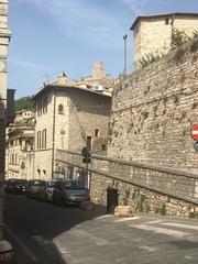 overview of Assisi town in Italy with historical buildings and hilly landscape