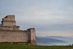 View of La Rocca monument with clouds, part of Italy's cultural heritage