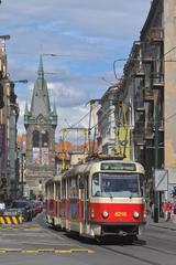 Tram number 9 passing by Jindřišská Tower in Prague