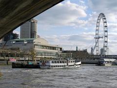 Royal Festival Hall and London Eye seen from beneath Waterloo Bridge over the River Thames