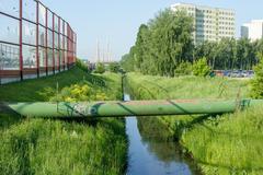 Kanał Nowa Ulga on the edge of Osiedle Gocław in Warsaw with acoustic screens of Trasa Siekierkowska and Siekierkowski Bridge