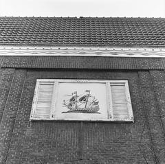 Rijksmonument number 505472 in Amsterdam showcasing a ship sculpture above the entrance of the museum