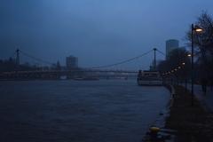 Holbeinsteg bridge in Frankfurt with fog after sunset