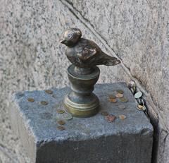 Coins near Chizhik-Pyzhik monument in Saint Petersburg