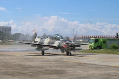 Two A-29B Super Tucano aircraft on the runway at Edwin Andrews Air Base, Zamboanga City, welcomed with a Water Cannon Salute