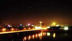 Ahmedabad riverfront with modern buildings and clear blue sky