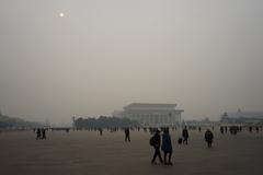 Tiananmen Square with tourists and historical buildings