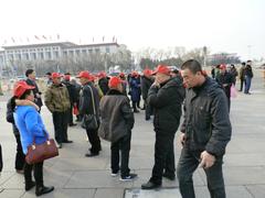 Tiananmen Square in Beijing with historical buildings and crowd of people