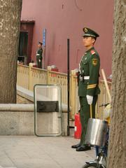 Chinese soldier standing guard at the entrance to Tiananmen Square in Beijing