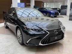 Front angle shot of a black Lexus ES in showroom