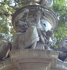 Allegory of Autumn on the Fountain of Apollo in Madrid, Spain