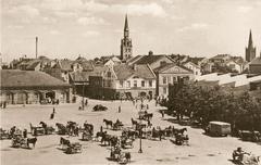 Tržnice area with Teatro aikštė, central St. John's Church tower, right Reformed Church tower, eastward view