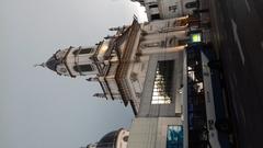 View of the Basilica from the corner of Rivadavia and Fray Cayetano de la Plaza Pueyrredón with cloudy sky