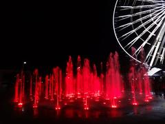 Ecofenix Fountain with red Ferris wheel in the background