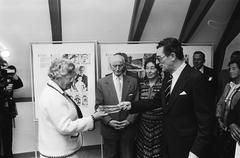 Queen Juliana receiving a book at the Anne Frank House re-opening, 1979