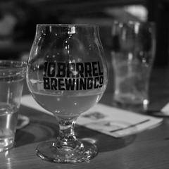 inside view of 10 Barrel Brewing Co. with customers and wooden decor