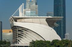 Panoramic view of Guangzhou skyline with modern high-rise buildings and lush green trees