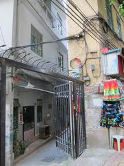 narrow alleyway entrance to residential area in China