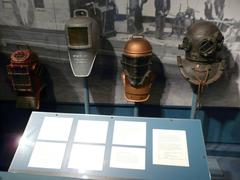 Exhibit hall at the Independence Seaport Museum in Philadelphia showcasing maritime artifacts and public domain paintings