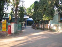 Hostel entrance gate with surrounding greenery