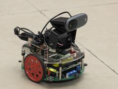 A robot developed by IIT Bombay students, remote-controlled by Aakash 2 tablet, displayed at a media workshop in 2012.