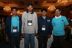 group photo of IIT Bombay students and IBM officials at an event