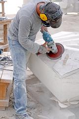 sculptor creating art from stone at the Parque de las Esculturas