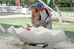 sculptor creating artwork at Parque de las Esculturas, Chile