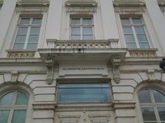 first-floor balcony supported by two corbels with scrolls and acanthus leaves