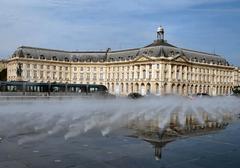 Effets d'eau at Place de la Bourse in Bordeaux with a tramway passing by