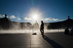 Miroir d'eau in Bordeaux reflecting Place de la Bourse and cloudy sky