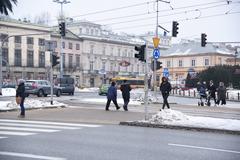 Warsaw in January 2018 with a snow-covered street and people walking