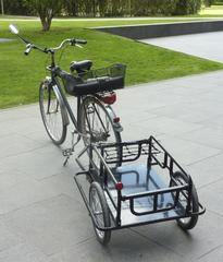 black two-wheeled bicycle cargo trailer with steel frame